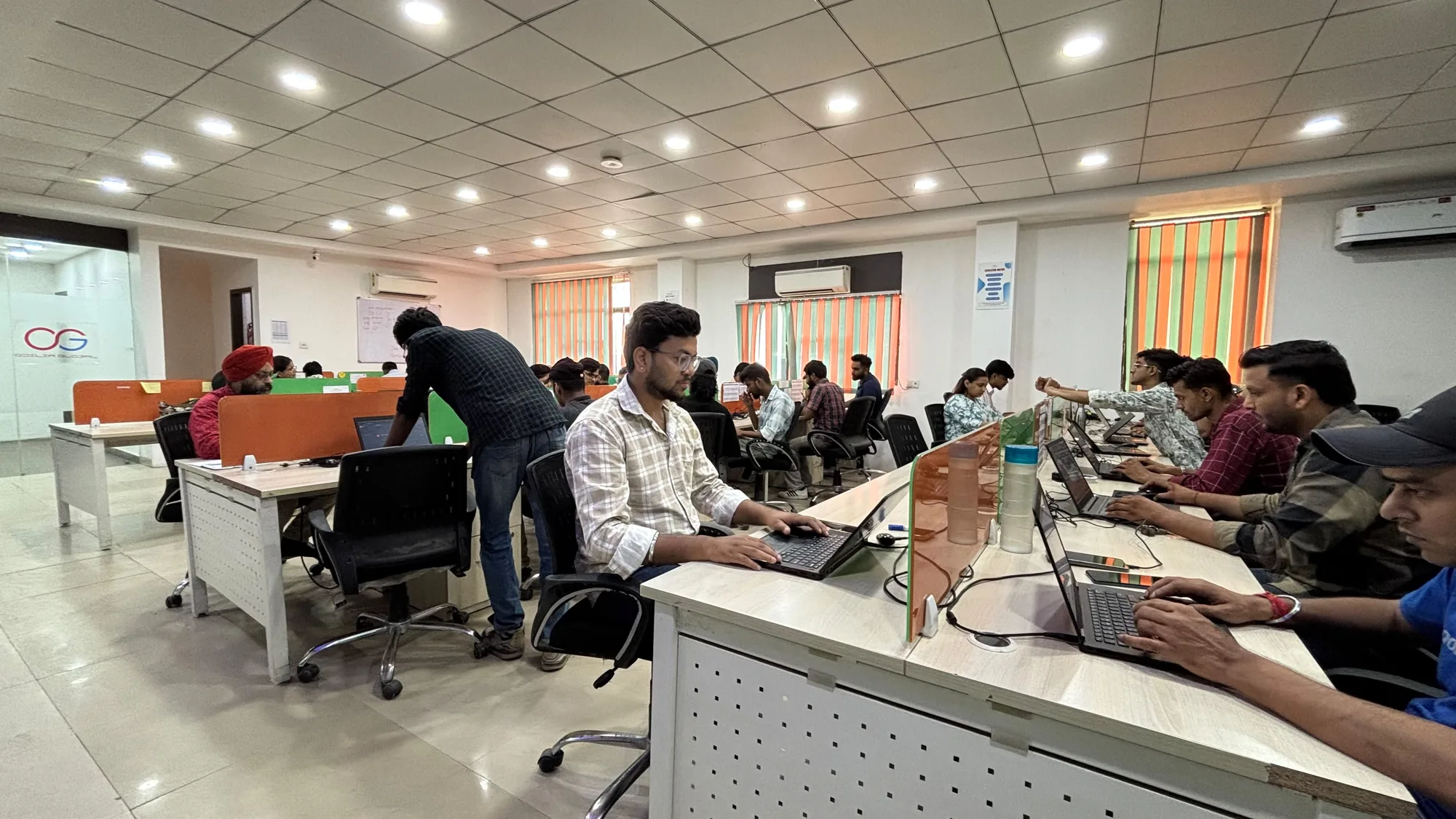Odilia Global delivery floor with operations teams at work
